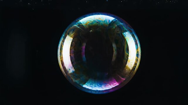 Mesmerizing Iridescent Soap Bubble Floating Against a Dark Background.