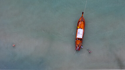 Top down aerial old wooden boats on dock Phuket southern Thailand © Andrew