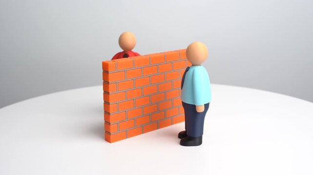 Two people separated by a brick wall. Misunderstandings and language barriers. Stereotypes. Finding common ground and gaining trust. Social conflict, isolation, cross-cultural understanding