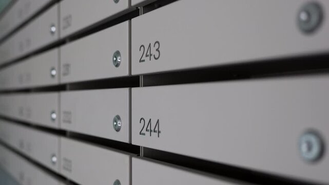 Numbered Apartment Mailboxes in Residential Building Hallway