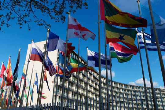 Paris, France - March 15, 2026 : Flags fluttering in the wind in front of the UNESCO (United Nations Educational, Scientific and Cultural Organization) headquarters at place de Fontenoy in Paris.