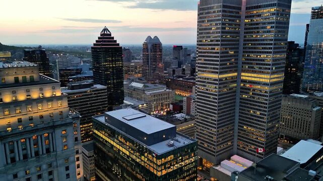 Aerial view of downtown Montreal at blue hour featuring Sun Life Building and city skyline, Quebec, Canada