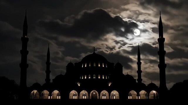 Striking silhouette of a grand mosque featuring multiple minarets and a central dome dramatically illuminated against a dark, cloudy, and partially eclipsed moonlit night sky.