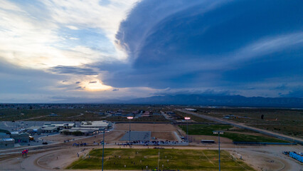 Stormy Dusk: Moody Sunset Over the High School Soccer Field