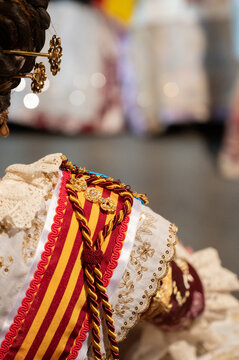 Fallera wearing traditional costume during Fallas festival in Valencia