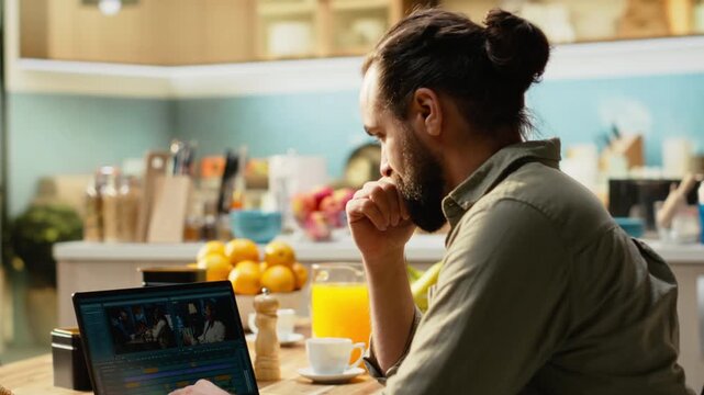 Portrait of man editing video clips and sound effects at laptop, videography and post production with cinematic color grading. VFX elements and interactive software, male content creator.