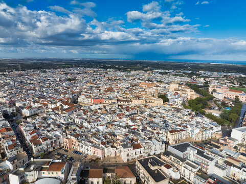 Discover Conversano: Arial view Pugliese Gem featuring the Acquaviva Castle, Stone-Carved Cathedral, Ancient Medieval Alleys near Bari, Italy