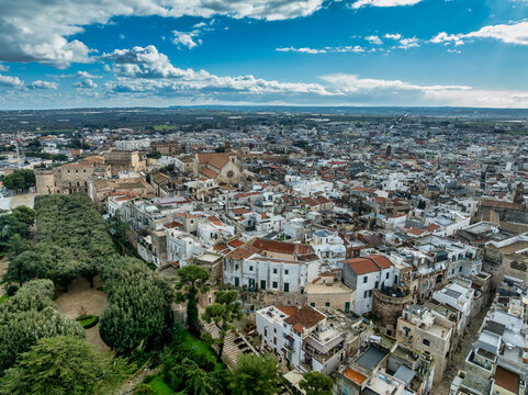 Discover Conversano: Arial view Pugliese Gem featuring the Acquaviva Castle, Stone-Carved Cathedral, Ancient Medieval Alleys near Bari, Italy