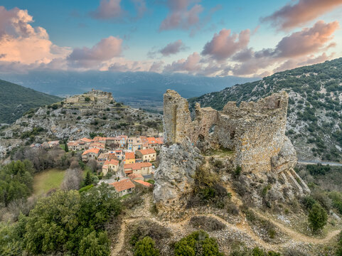 Visit the Castles of Fenouillet: Aerial view Saint-Pierre and Sabarda, a dual-fortress Cathar site curtain walls and panoramic Pyrenean views