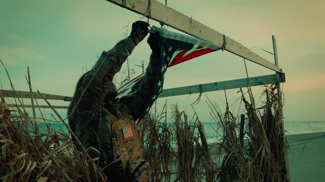 Memorial Day celebration at an American outpost with flag and soldier