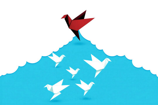 Colorful origami birds flying upward over blue waves showing leadership and success concept