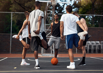 Fototapeta premium Basketball, fitness and stretching with friends outdoor together for start of competition or game. Exercise, preparation and warm up with group of people getting ready for sports challenge on court
