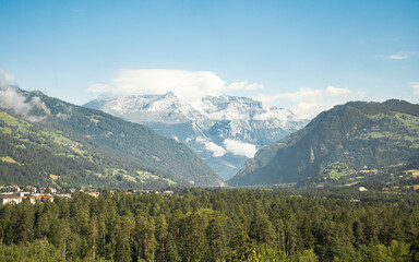 Fototapeta premium Panoramic View of Swiss Alps Mountains and Glacier, Stunning Alpine Landscape Along the Glacier Express Scenic Railway