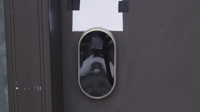 Modern smart door lock installation process showing close-up views of the device on a brown door with a blank paper above it