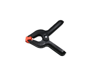 Obraz premium Spring Clamp isolated on white background. clipping path. for clamping background cloth or reflector on a support pole in the world of photography