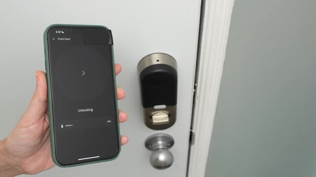 Person using smartphone to unlock smart door lock, showing progression from locked to unlocked state in a home entryway setting