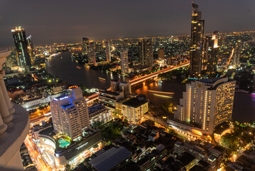 Obraz premium City twilight Amazing cityscape light. Panorama view of Bangkok city skyline night time sunset sky. Beautiful skyscraper midtown landscape. Capital building background modern office district