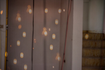 Fototapeta premium Background light bulb blurry background interior design bar table chair windows with copy space. Blurred background cafe coffee shop restaurant in shopping mall with light bokeh business event