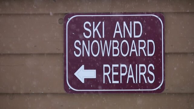 Ski and Snowboard repairs sign. British Columbia, Canada. HD video.