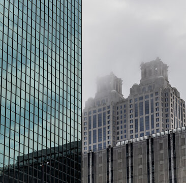 View of the Downtown Atlanta Skyline Cityscape showing several prominent buildings, and hotels on a cloudy afternoon.