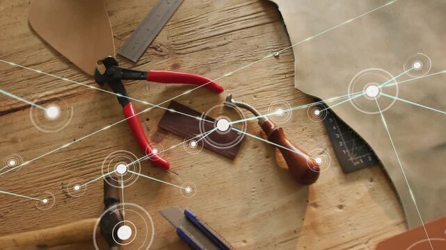 Pulsing HUD near pliers spawning network lines, nodes linking tools for leathercraft layout