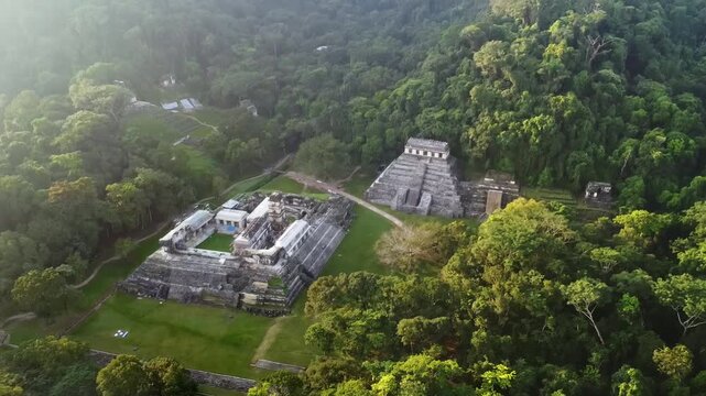 Aerial drone view of Palenque Mayan ruins featuring ancient pyramids and temples surrounded by tropical jungle in southern Mexico