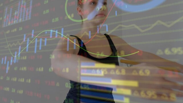 Cam pulling back, woman at barre doing plie to balance, finance charts overlaying, peer appearing