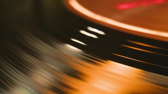 Retro Vinyl record player playing music, needle close-up macro shot of vintage LP disc old phonograph spinning. Retro music player at home.