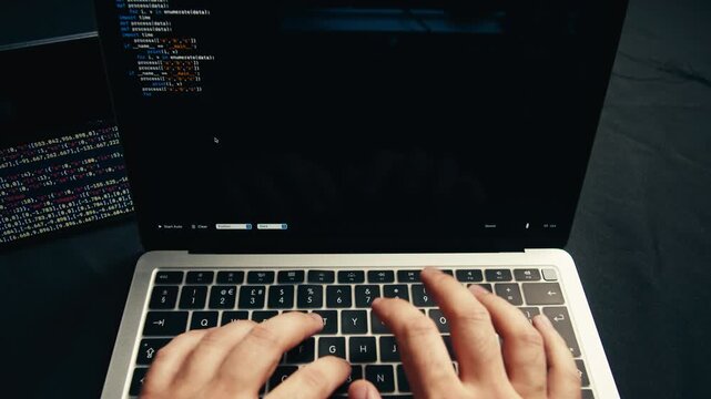 Man work with chatbot AI online, connecting with AI and using a chat bot. IT engineer software developer programmer interact with chat bot, making writing code. Typing on laptop keyboard