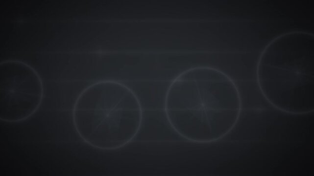 Abstract circles and lines float on a dark gray field