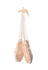 Pink pointe shoes hanging on white background, back view