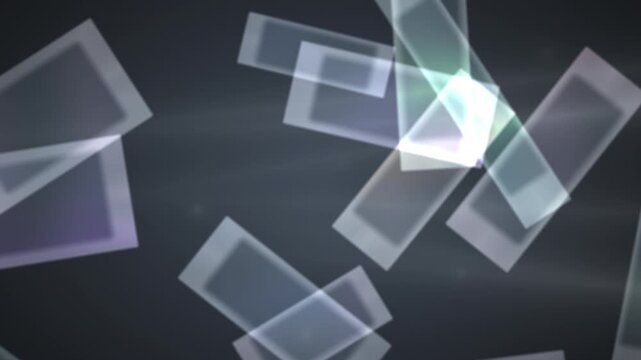 Geometric shapes float and overlap in soft motion against a dark gray background