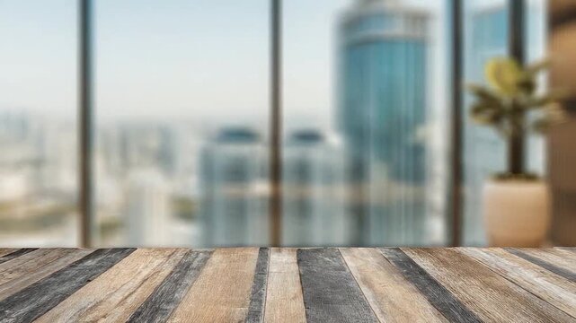 Empty wooden table with blurred city skyline background through office window