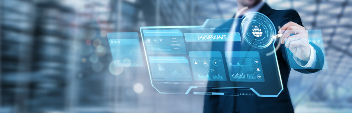 Businessman pointing at a digital screen and analyzing e-governance systems, digital government services, public sector technology innovation, online citizen services platforms
