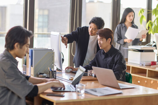 Office professionals engaged in focused work