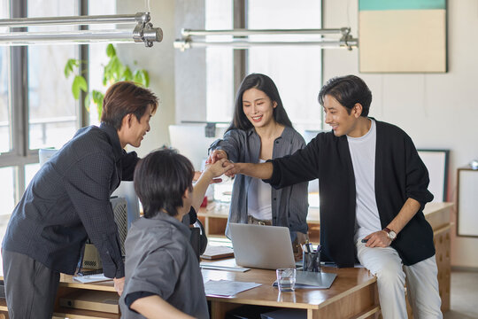 A team of business professionals working diligently in the office