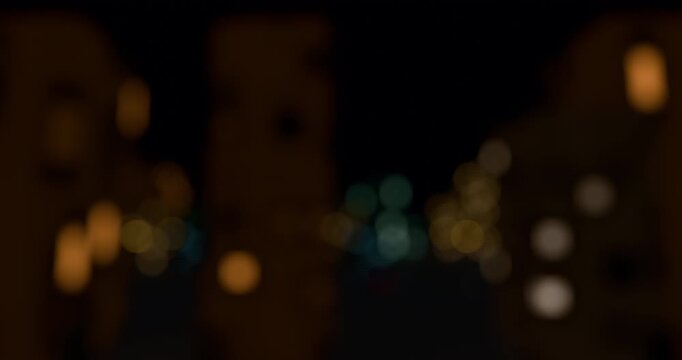 Abstract view of blurred city light from train. Defocused building lights from moving traffic on a urban night cityscape. Round colorful bokeh effect. 4K 3D rendering loop animation.