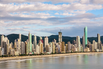 Fototapeta premium Coast of Balneario Camboriu City With Tall Skyscrapers and Dramatic Sky