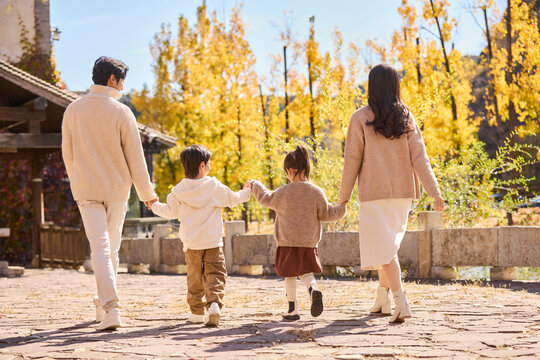 Young family visiting man-made historic town scenic site