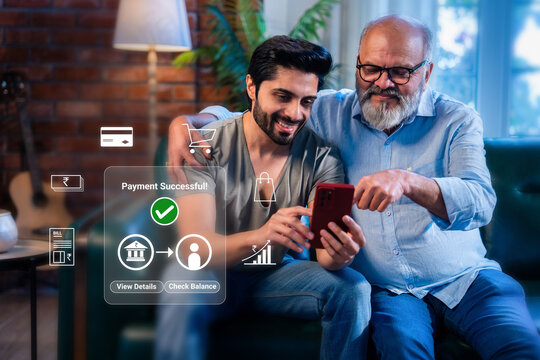 Indian handsome young man and senior father smiling after online digital payment successful on laptop