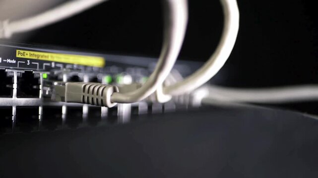 network switch with ethernet utp cables close up panning shot.