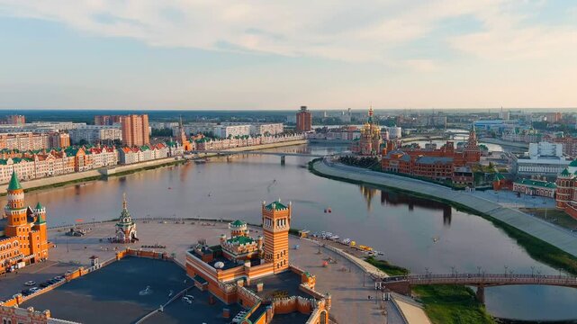 Yoshkar-Ola, Russia. City center during sunset. Embankment of the river Malaya Kokshaga. Drone footage