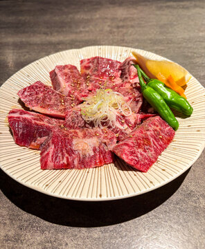 Premium harami beef (skirt steak) for yakiniku, raw marinated Japanese BBQ meat close up