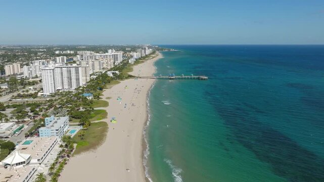 Aerial View of Pompano Beach With Pier, Bridge, Boats, Waterfront, Residential Blocks, Roads and Ocean Horizon
