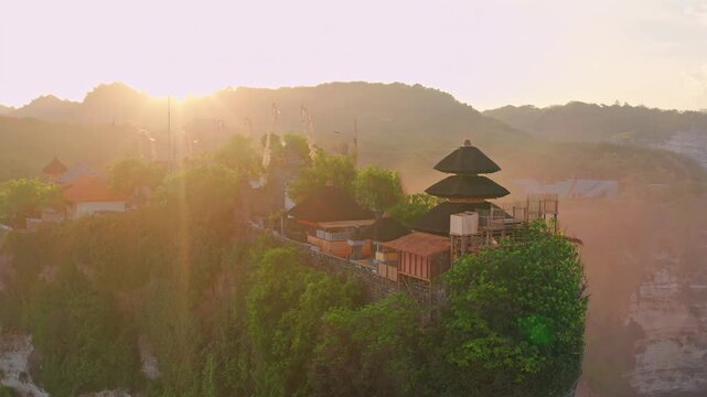 Bali, Indonesia, aerial view of Pura Luhur Uluwatu temple at sunrise.