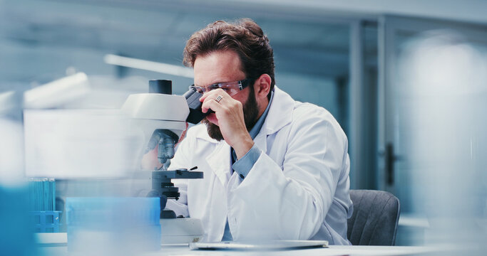 Man, scientist or microscope with glasses in laboratory for medical research, investigation or exam. Male person, biotechnology or experiment with test for forensic study, clinic trial or results