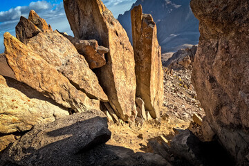 Sharp rock ridges and boulders encountered during the trek through the Tashkent sites area.