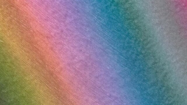 Seamless loop of pastel rainbow gradient flowing diagonally with soft fabric texture background for dynamic video backdrop