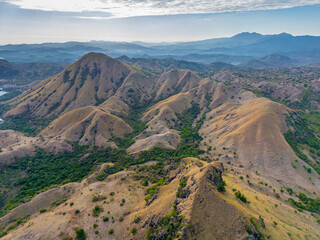 Aerial vertical view of Komodo National Park, Indonesia. Drone shot, top view. Mountain view and tropical beach