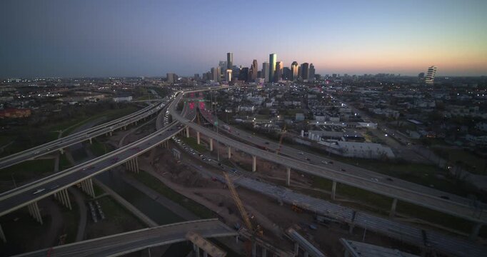 Capture the breathtaking beauty of Houston, Texas, with this wide-angle, high-altitude establishing shot of the downtown skyline at sunset
